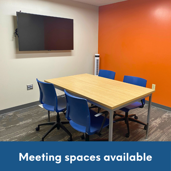 meeting room with table and chairs and tv on the wall and text: Meeting spaces available