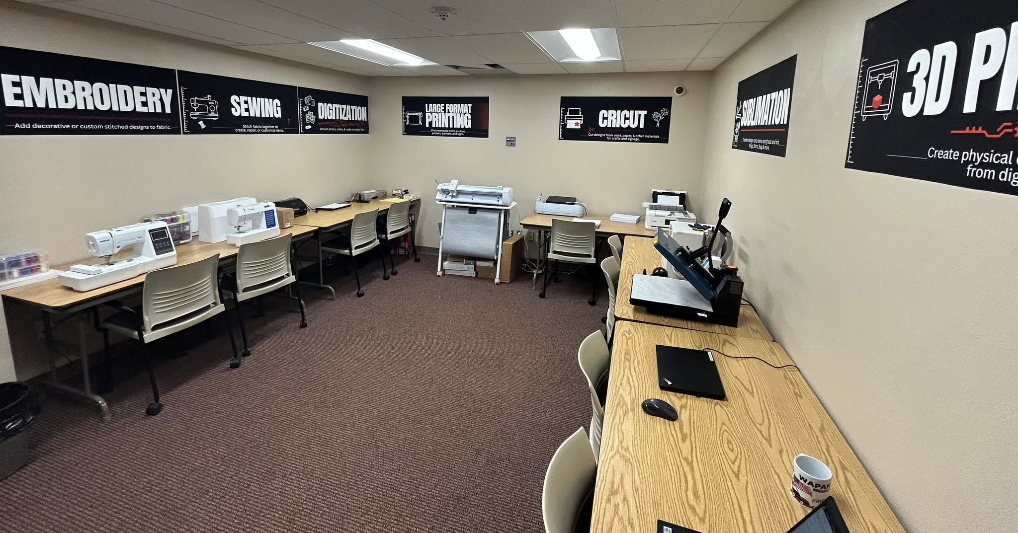 room with makerspace machines and signs