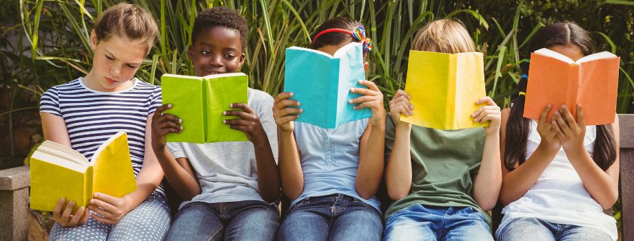 kids reading books outside